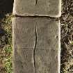 View of recumbent grave slab with three incised crosses