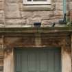 Detail of lintel above doorway at Working Men's Home, 70-76 Grove Street, Edinburgh.