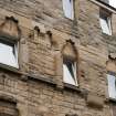Detail of second floor windows at Working Men's Home, 70-76 Grove Street, Edinburgh.