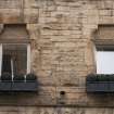 Detail of first floor windows at Working Men's Home, 70-76 Grove Street, Edinburgh.