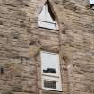 Detail of second and third floor windows at Working Men's Home, 70-76 Grove Street, Edinburgh.