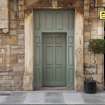 Detail of doorway and lintel at Working Men's Home, 70-76 Grove Street, Edinburgh.