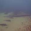 View of hull plates of steamship Il Senstein and encroaching sand