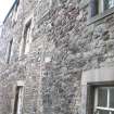 View of altered doorway/window openings on west elevation of Cadell House, Panmure Close, 129 Canongate, Edinburgh.