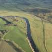 Oblique aerial view of the flood bank, looking SE.