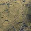Oblique aerial view of the mining remains and field systems, looking NNW.