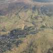 General oblique aerial view of Leadhills village, the mining remains and the golf course, looking E.
