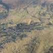 General oblique aerial view of Leadhills village, the mining remains and the golf course, looking E.