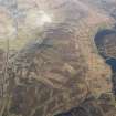 General oblique aerial view of Leadhills village and reservoir, and the mining remains, looking NNE.