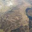 General oblique aerial view of Leadhills village and reservoir, and the the mining remains, looking NNE.