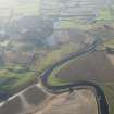 General oblique aerial view along the River Isla with the flood damage in the foreground and Coupar Angus in the middle distance, looking SW.