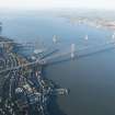 General oblique aerial view of the Forth Road Bridge and the construction of the Queensferry Crossing, looking WNW.