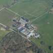 Oblique aerial view of Auchenskeock Castle and Farm, looking N.