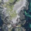 Oblique aerial view of a kelp working site at Am Meall on Tiree, looking NE.