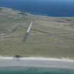 Oblique aerial view of Dun Heanish on Tiree, looking NW.