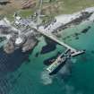General oblique aerial view of Scarinish ferry terminal on Tiree, looking WSW.