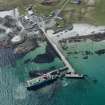 General oblique aerial view of Scarinish ferry terminal on Tiree, looking SW.