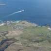 General oblique aerial view of Scarinish on the Isle of Tiree, looking E.