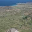 General oblique aerial view of Coll centred on the airfield, looking NNE.