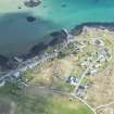 Oblique aerial view of Arinagour on the Isle of Coll, looking E.