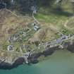 Oblique aerial view of Arinagour on the Isle of Coll, looking WSW.