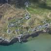 Oblique aerial view of Arinagour on the Isle of Coll, looking WSW.