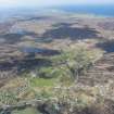 General oblique aerial view of Coll with Gunna and Tiree beyond, looking SW.