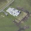 Oblique aerial view of an operations block at Baugh on the Isle of Tiree, looking NW.