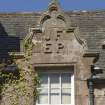 South east facade, detail of pediment with carved initials (JF EP)