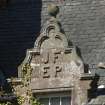 South east facade, detail of pediment above window with carved initials (JF EP)