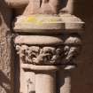 Gallery, arched stone seat, detail of carved capital