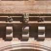 South west facade, detail of corbelling with carved head