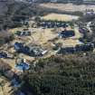 Oblique aerial view of Bangour Village Hospital Block, Church, Nurses Home and Villa 31, looking ESE.