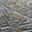 Oblique aerial view of The Hilltown, SS Peter and Paul Roman Catholic Church and Dens Park, looking NNE.