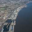 General oblique aerial view of the harbour area of Dundee centred on Camperdown Dock and King V Wharf, looking NNE.