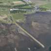 Oblique aerial view of fishing stands on the River Alness, Dalmore Distillery and pier, looking NNW.