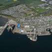General oblique aerial view of Invergordon harbour and oil rig service base, looking N.
