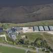 Oblique aerial view of the Glenmorangie Distillery, looking NE.