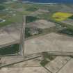 General oblique aerial view of Fearn Airfield, looking ESE.