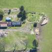 Oblique aerial view of Cairn Irenan chambered cairn, looking SSE.