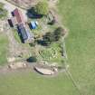 Oblique aerial view of Cairn Irenan chambered cairn, looking E.