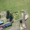 Oblique aerial view of Cairn Irenan chambered cairn, looking SSE.