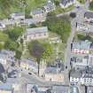 Oblique aerial view of St Duthus's Collegiate Church and Tolbooth in Tain, looking N.