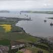 General oblique aerial view centred on Invergordon with the Cromarty and Moray Firths beyond, looking E.