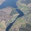 General oblique aerial view of Lairg with the power station and dam beyond, looking NW.