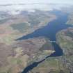 General oblique aerial view of Lairg with Loch Shin beyond, looking WNW.