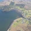 General oblique aerial view centred on Poolewe with a fish trap at Inverewe House beyond, looking ENE.
