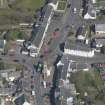 Oblique aerial view of Kilmaurs Market Cross and Tolbooth, looking N.