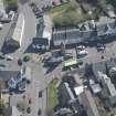 Oblique aerial view of Kilmaurs Market Cross and Tolbooth, looking E.