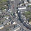 Oblique aerial view of Kilmaurs Market Cross and Tolbooth, looking N.